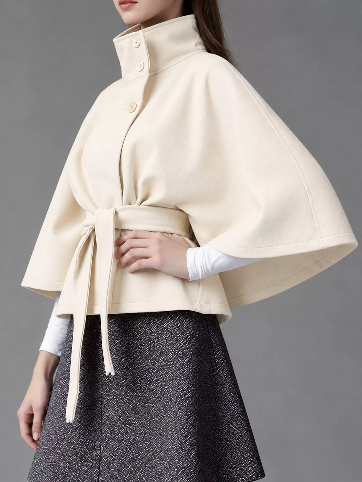 White belted button-front cape — side view