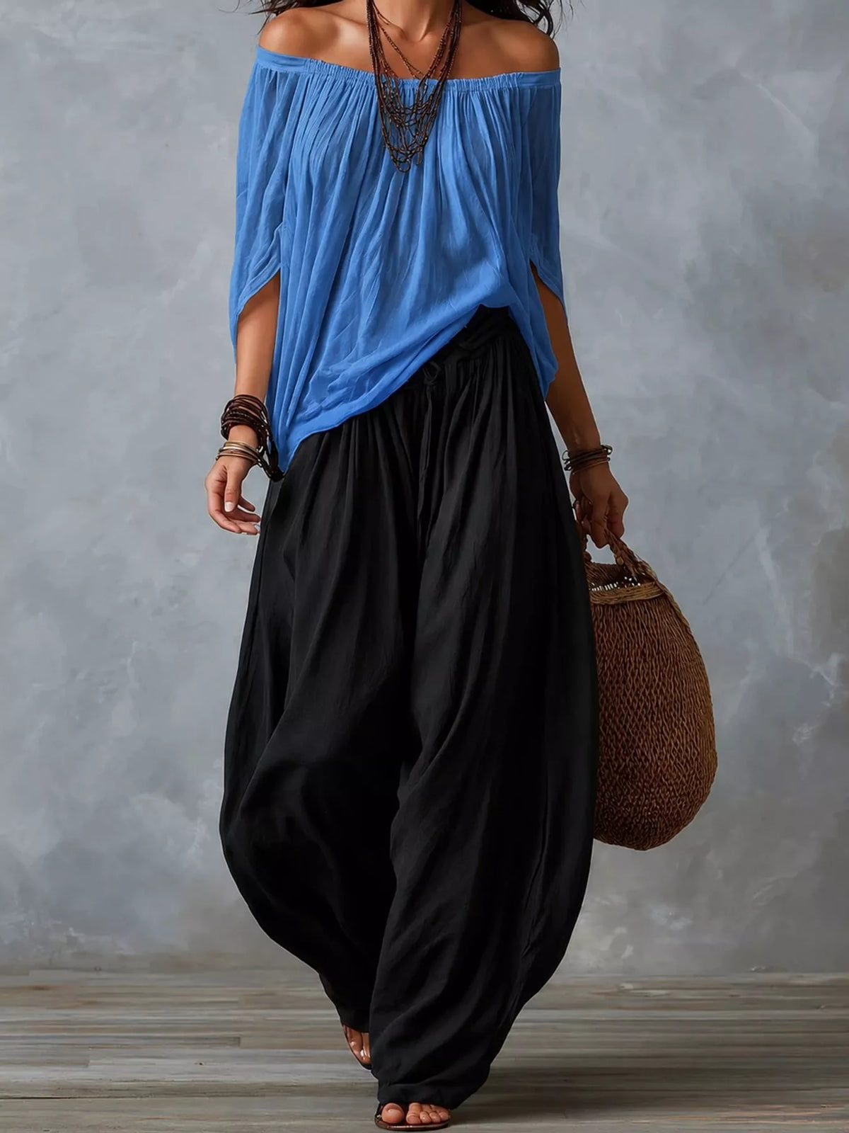 Blue top and black pants off-shoulder top and wide-leg harem pants set — front view