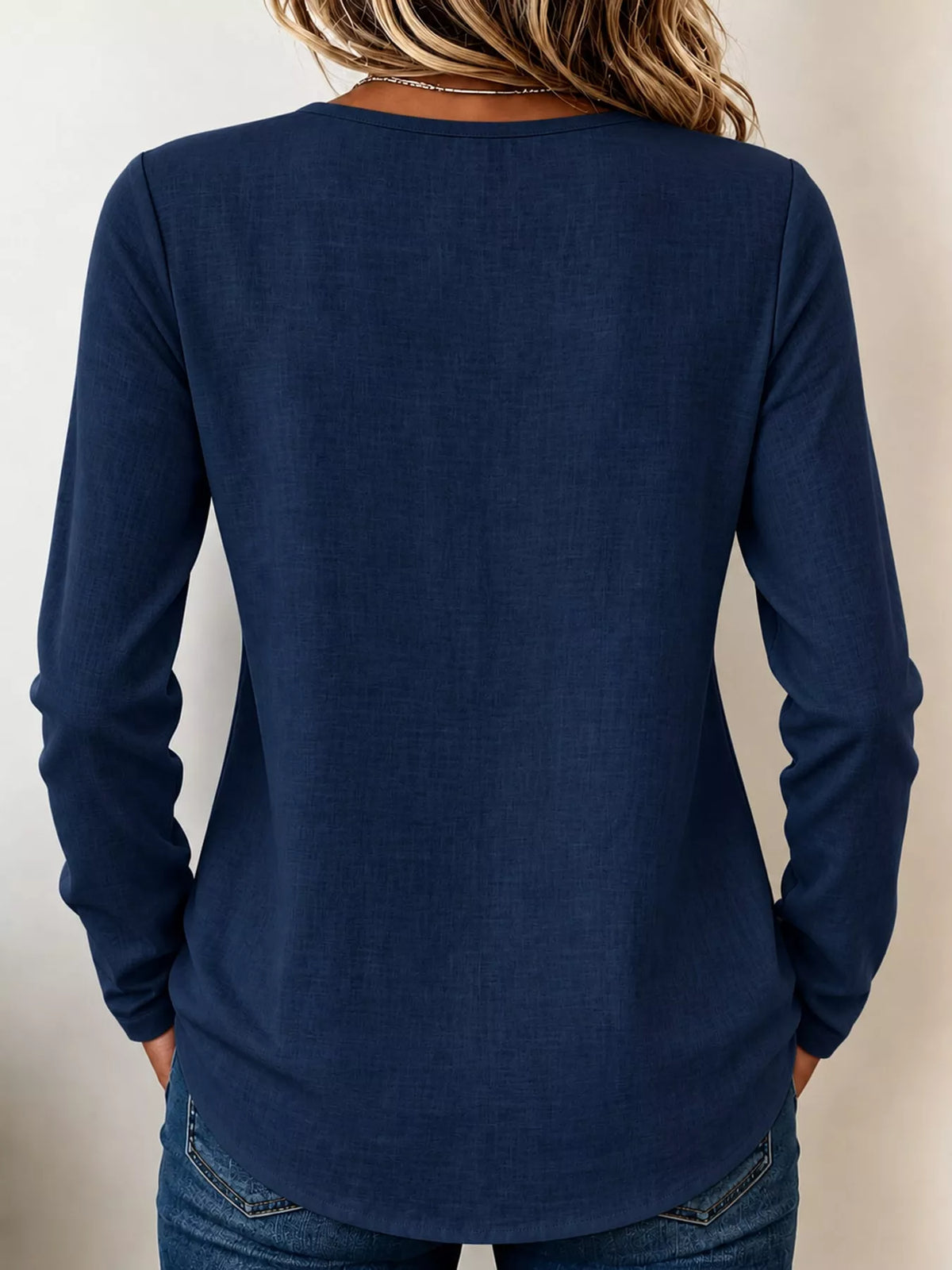 Navy long sleeve decorative button blouse, back view