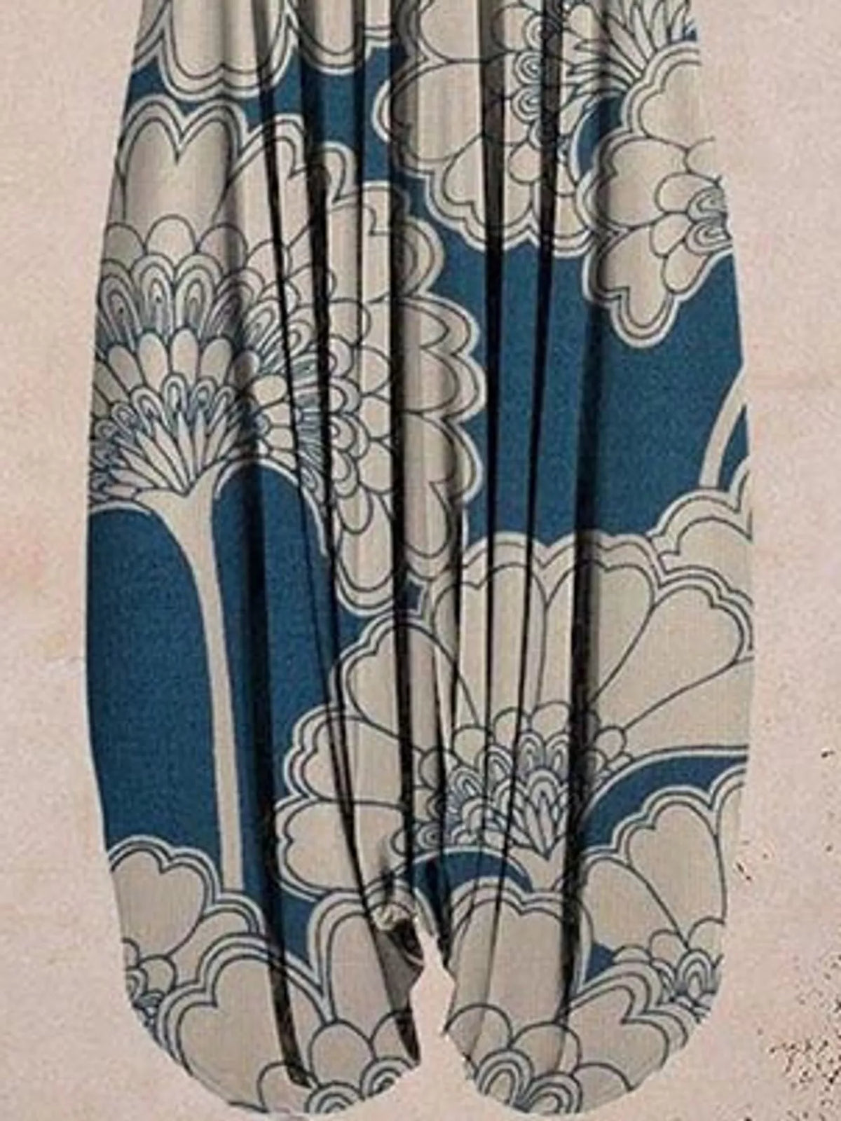 Blue and cream floral-print V-neck sleeveless jumpsuit, leg and print detail