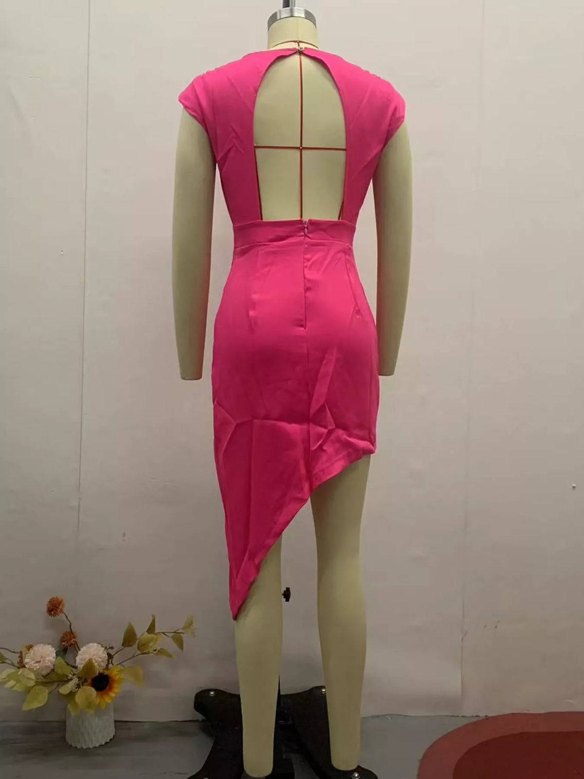Women's Asymmetrical Backless Pleated Dress in pink — mannequin back view
