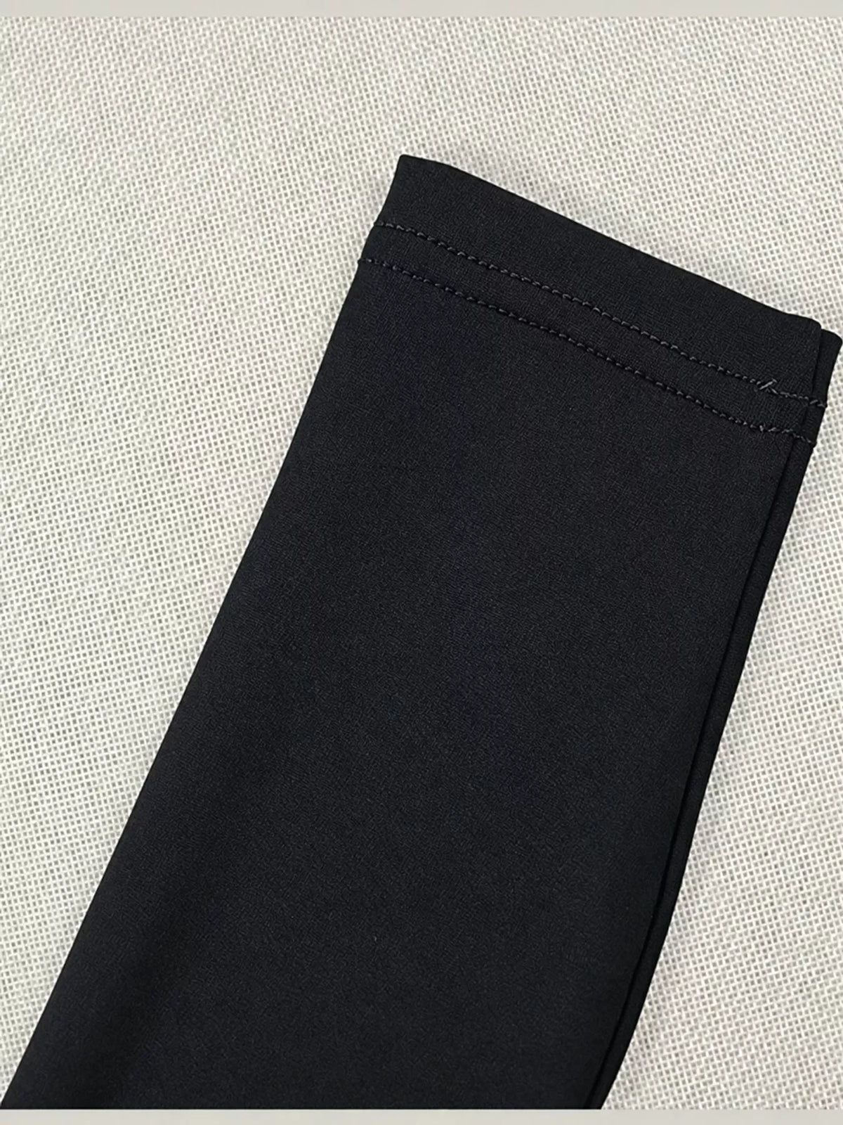 Black long sleeve cutout ruched maxi dress, detail view