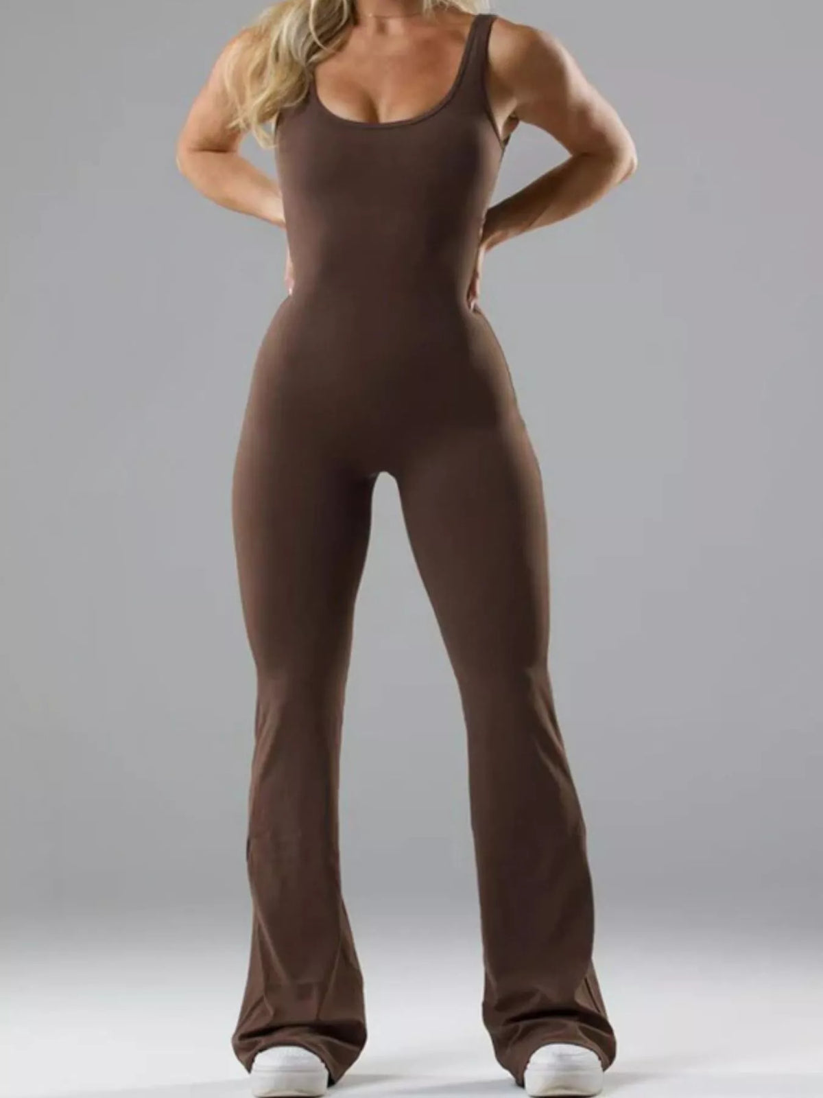 Brown scoop-neck flared-leg active jumpsuit, full front view.