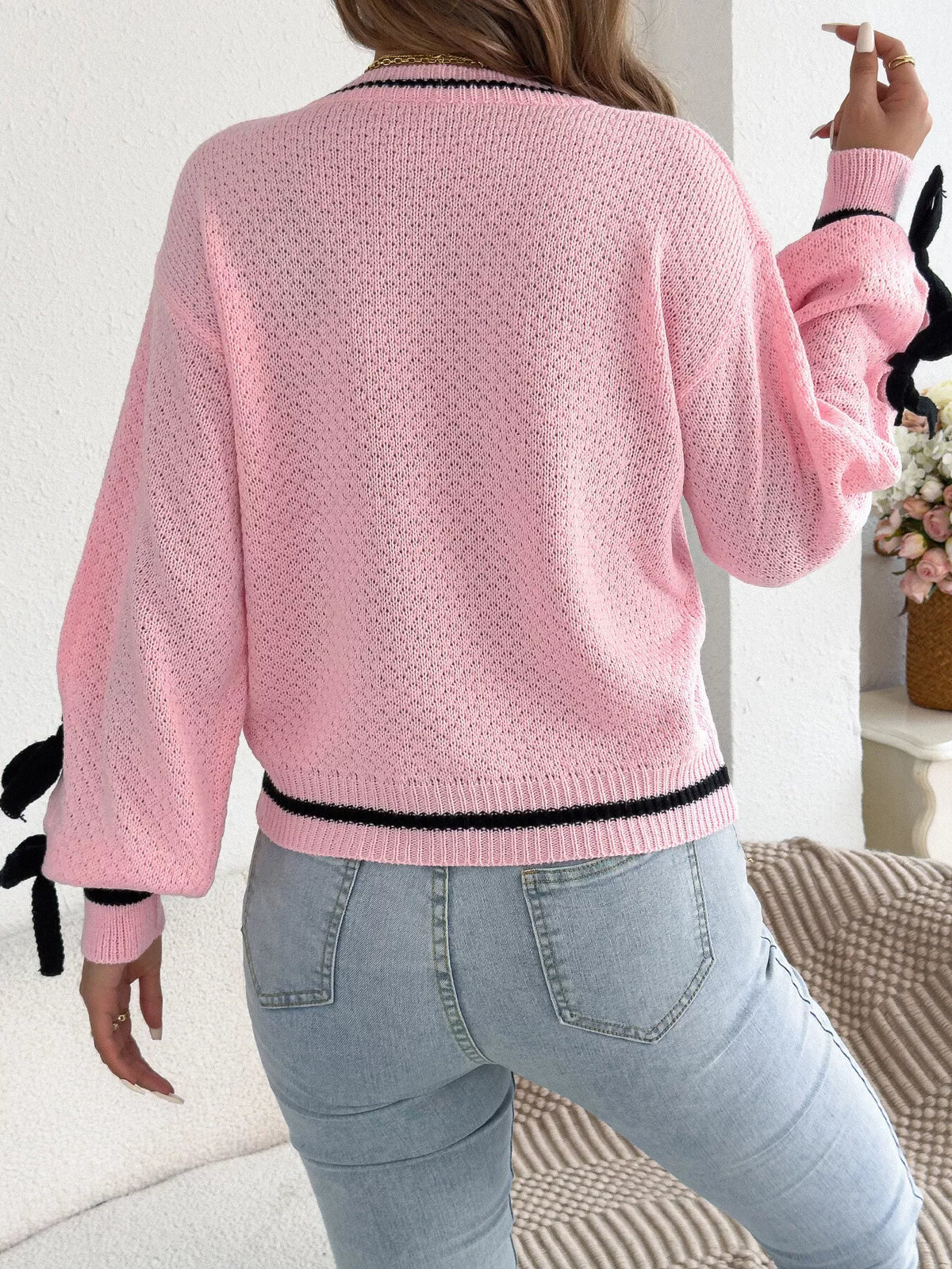 Pink contrast bow-tie sleeve crew neck sweater, back view