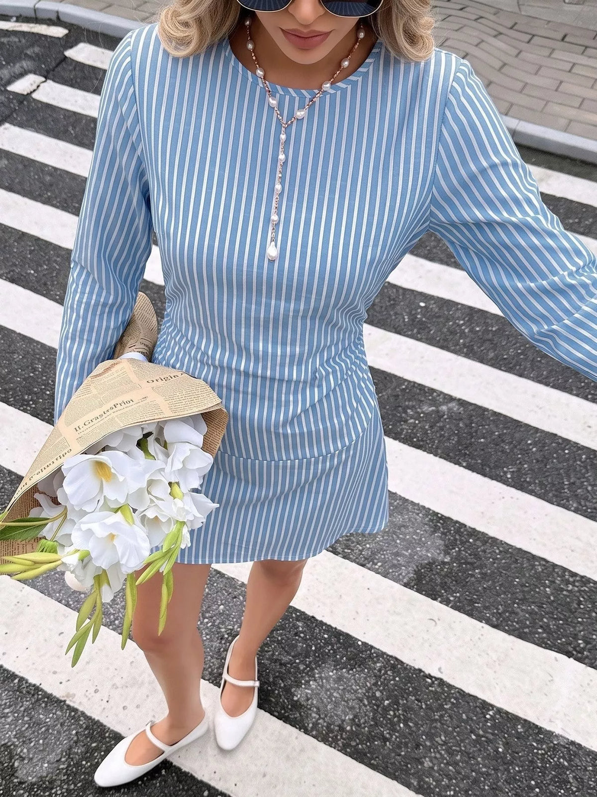 Blue striped long sleeve mini dress, front styled view