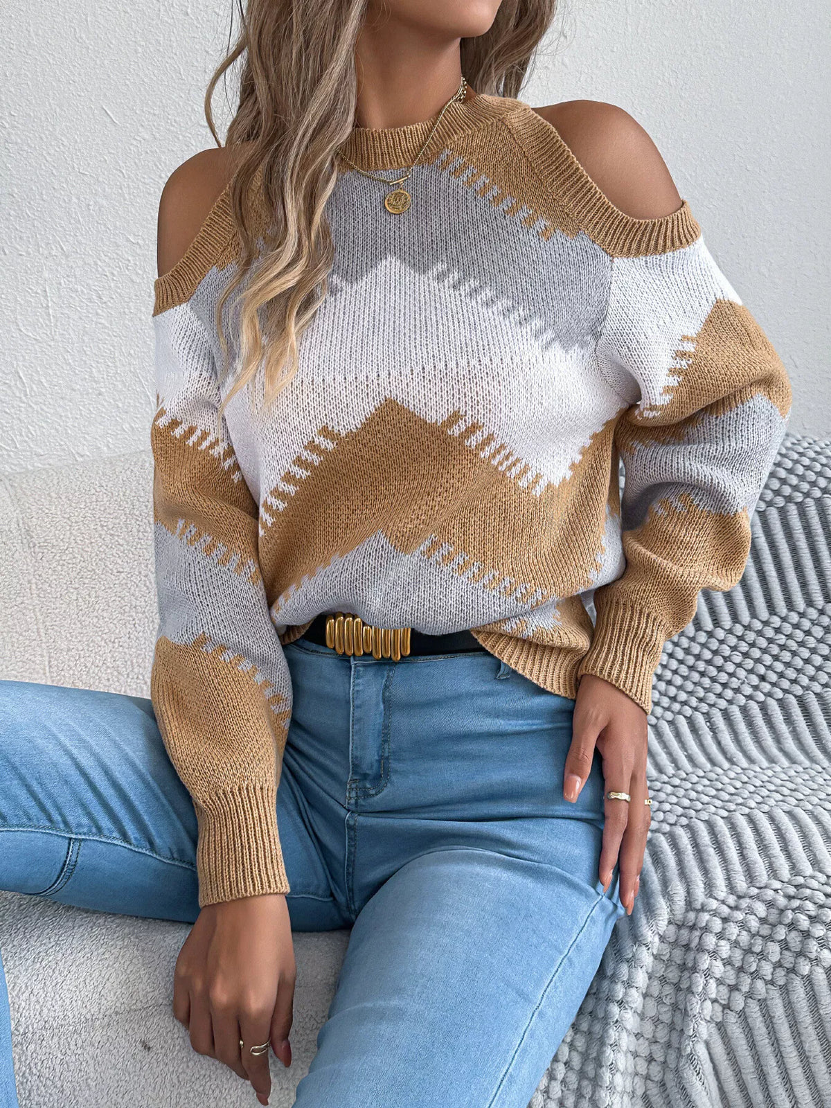 Tan, white and gray cold shoulder chevron pattern knit sweater
