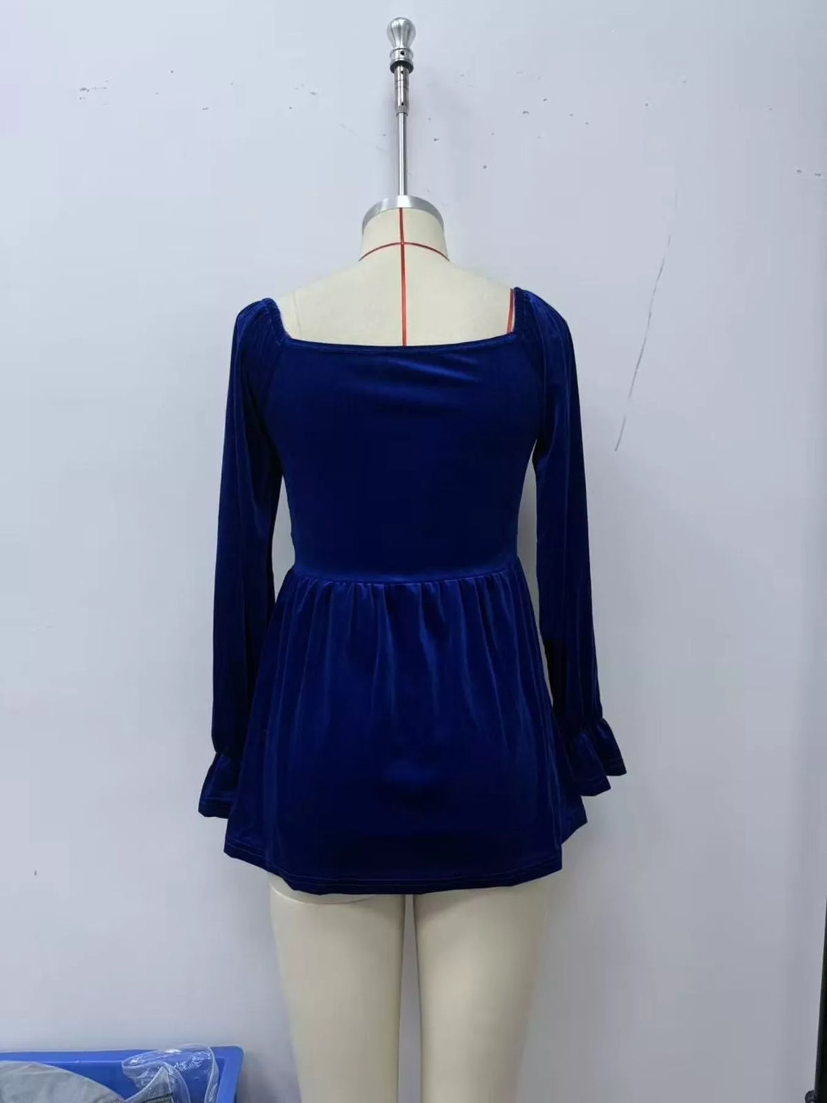 Women's Velvet Smocked Peplum Blouse in Indigo, back view