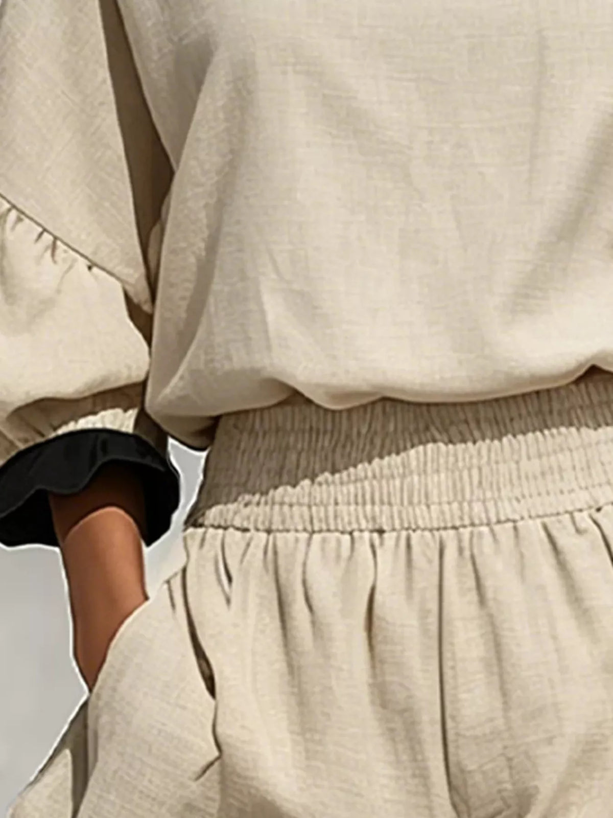 Beige and black contrast-ruffle top and shorts set, waistband and cuff detail