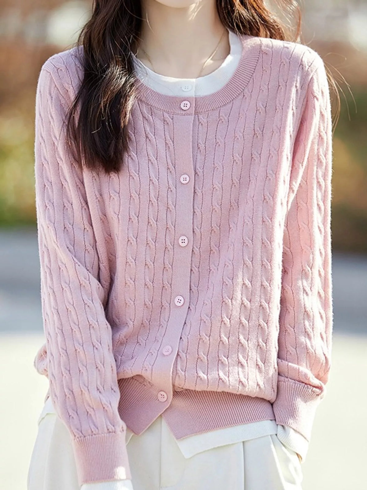 Pink cable-knit button-down cardigan