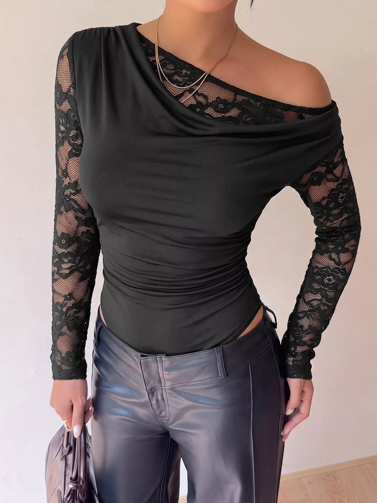 Black lace-sleeve draped bodysuit