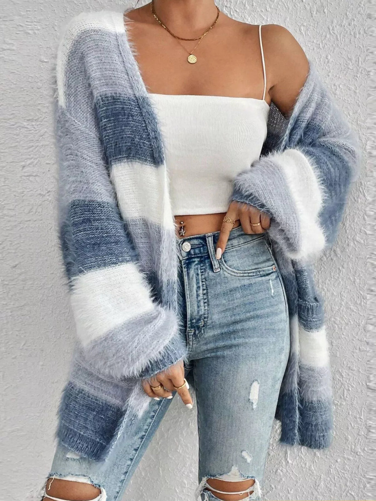 Blue and white striped open-front oversized cardigan, angled front view.