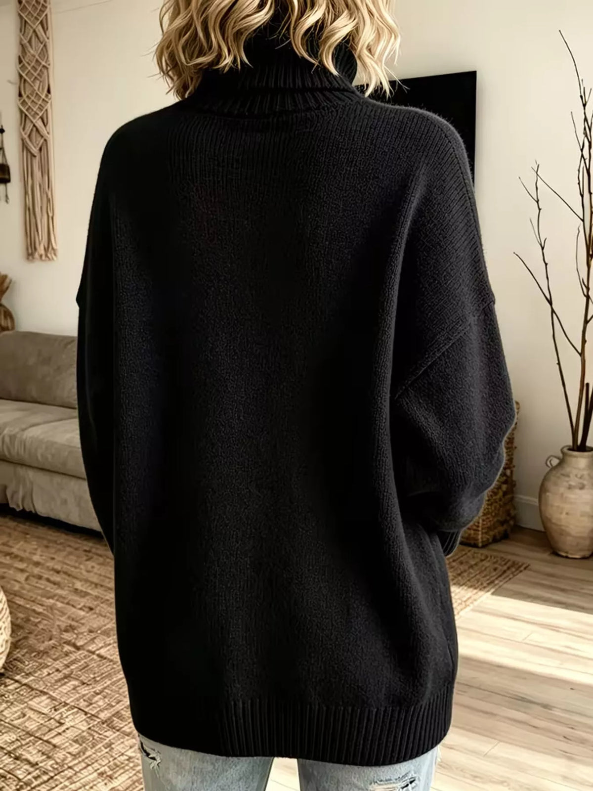Black turtleneck sweater, back view
