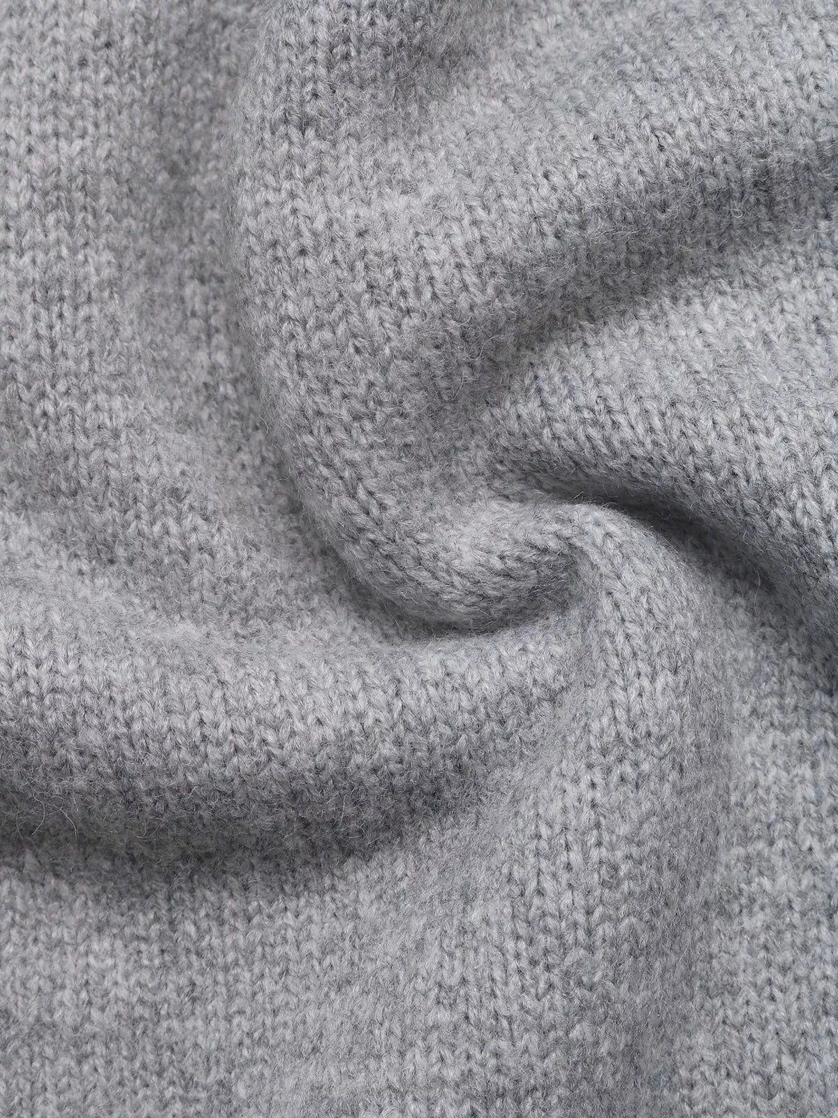 Gray bow-detail knit sweater vest, knit texture close-up