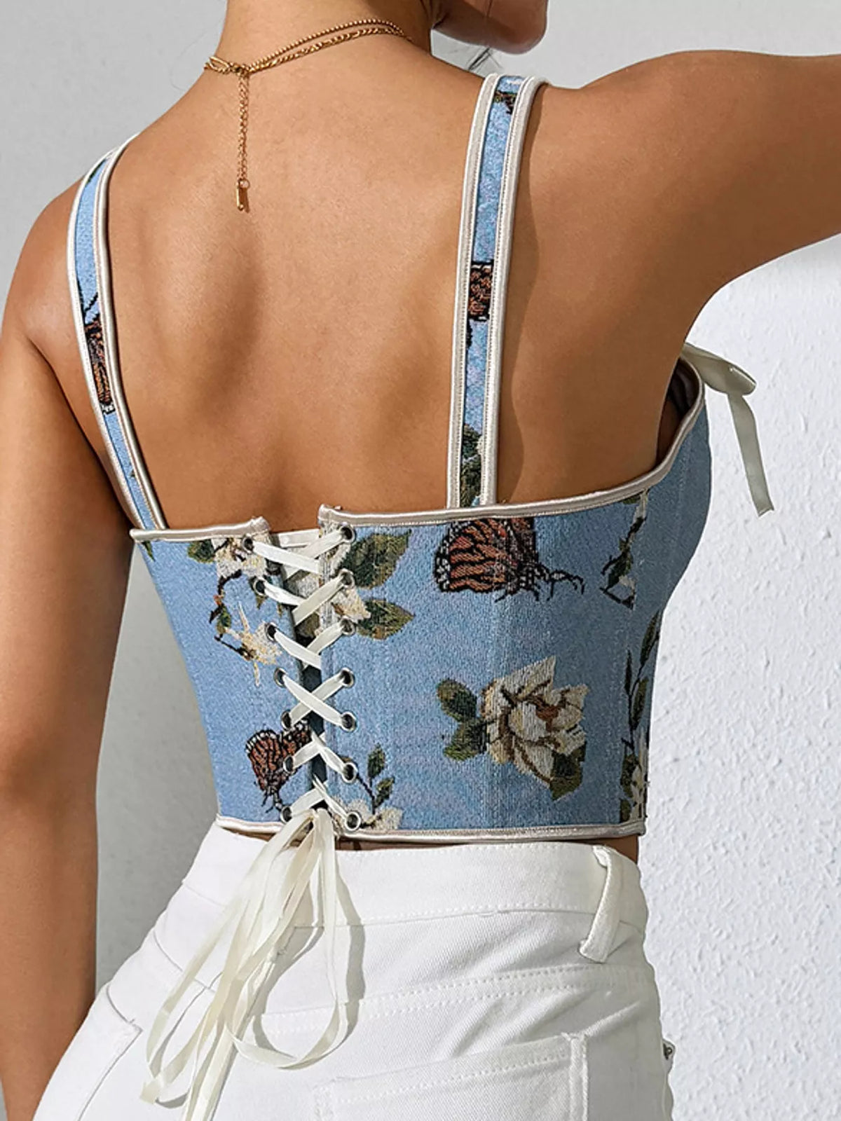 Blue floral lace-up back tank, back view