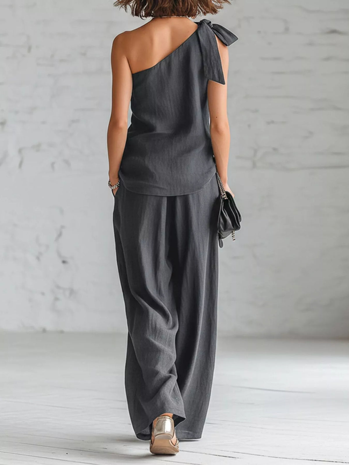 One-Shoulder Bow Top and Wide-Leg Pants Set in black, back view