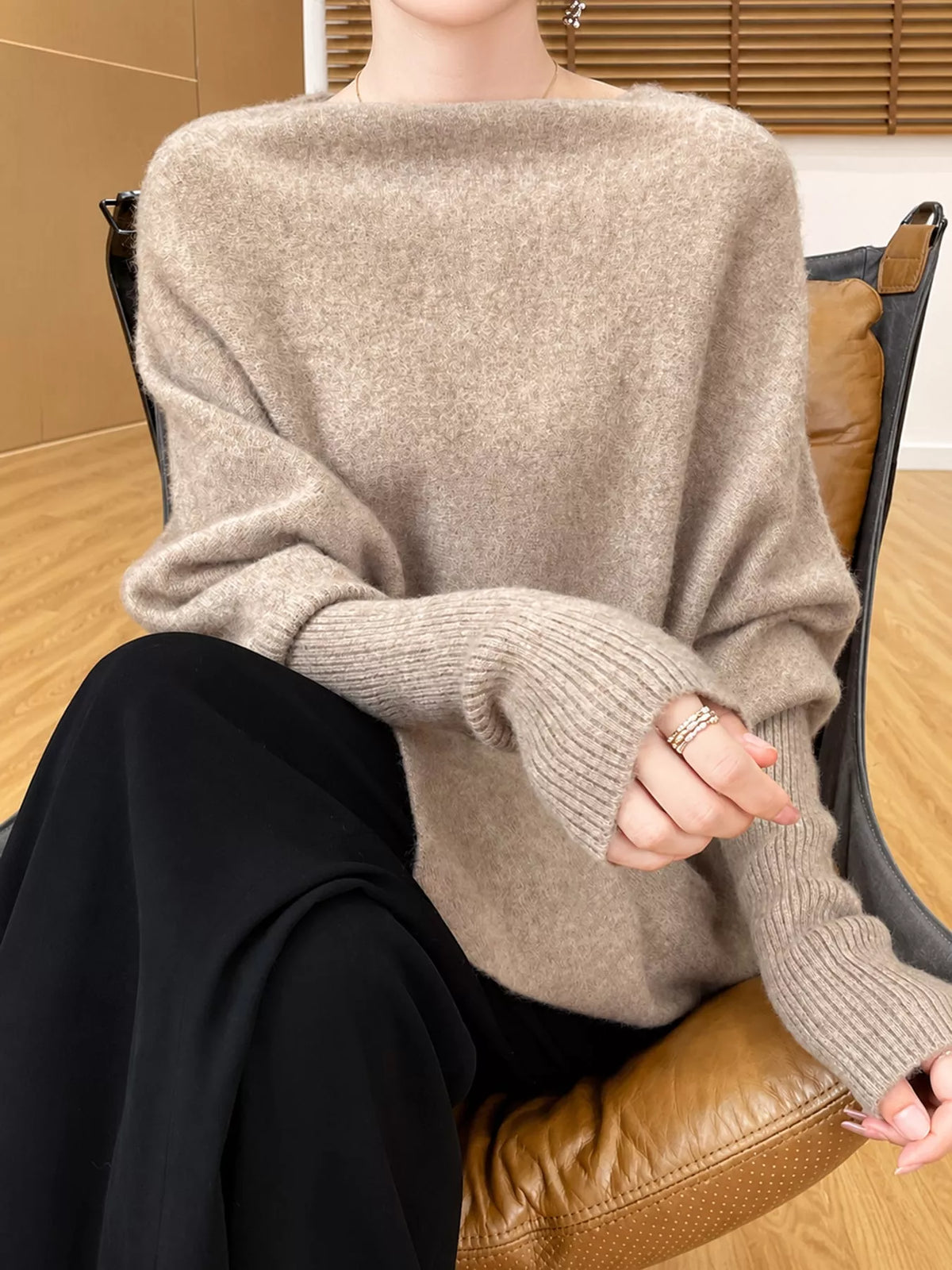 Taupe asymmetrical lantern sleeve sweater — front view