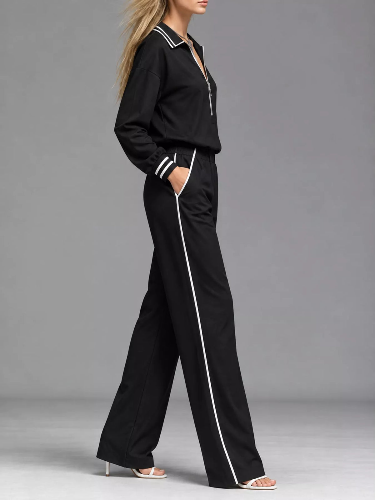 Black striped half zip top and pants set, side view