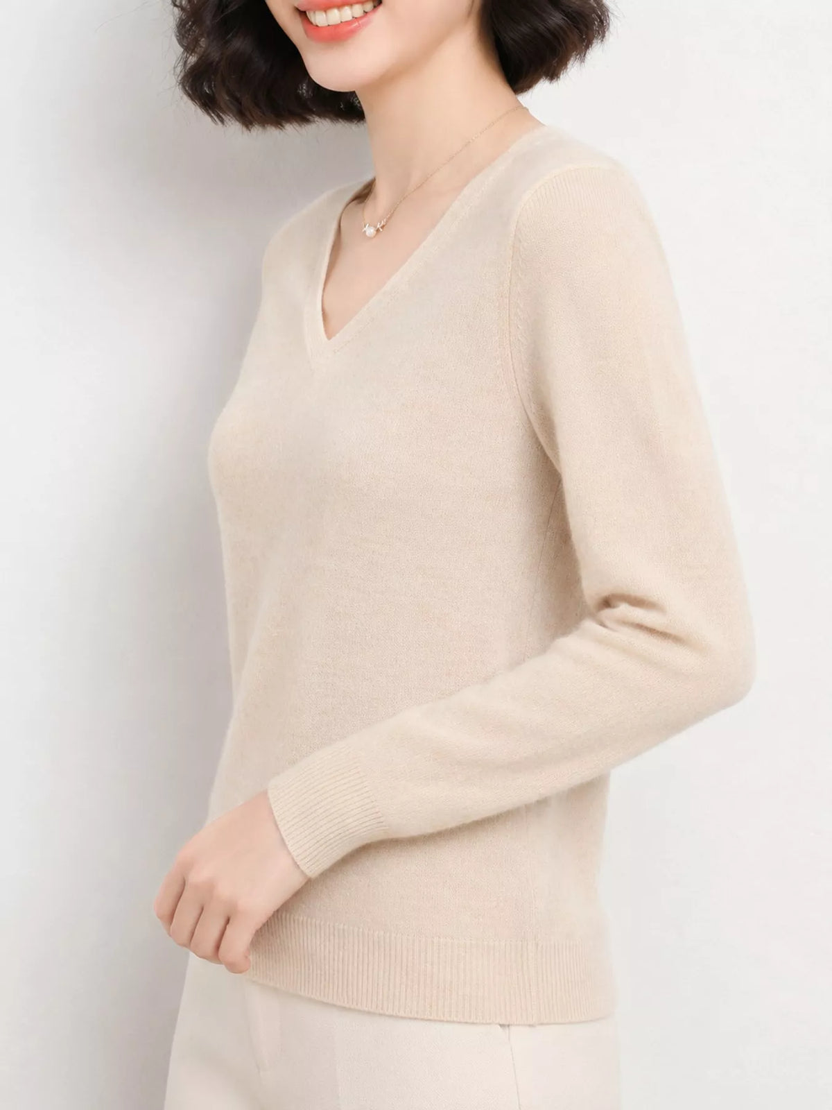Beige v-neck long sleeve knit top