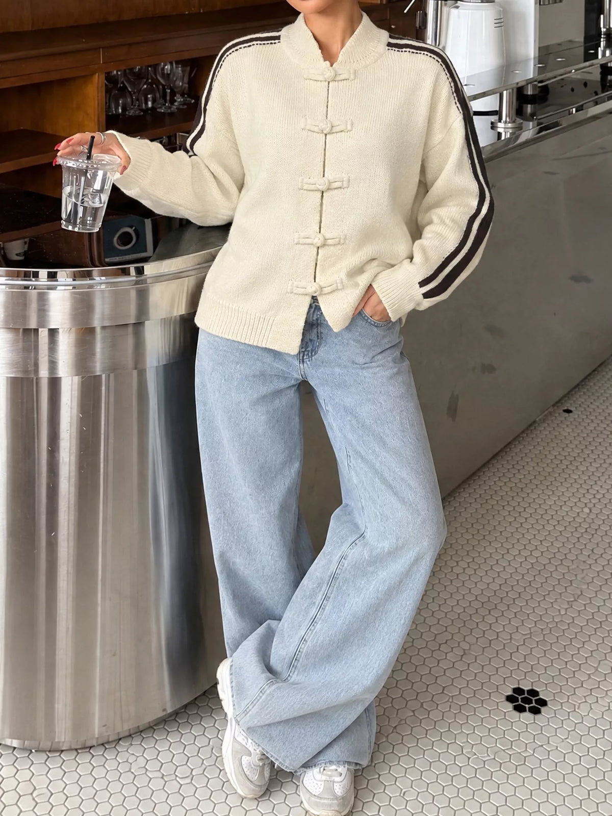 Cream Chinese knot button cardigan with sleeve stripes, full styled view