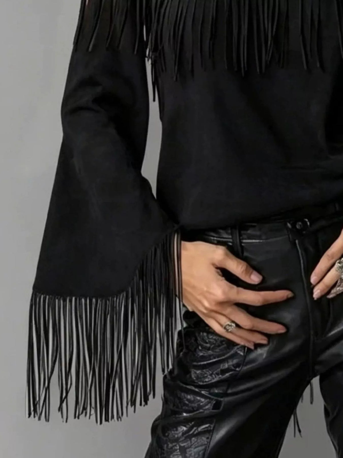 Off-shoulder faux suede fringe top in black, cuff fringe detail