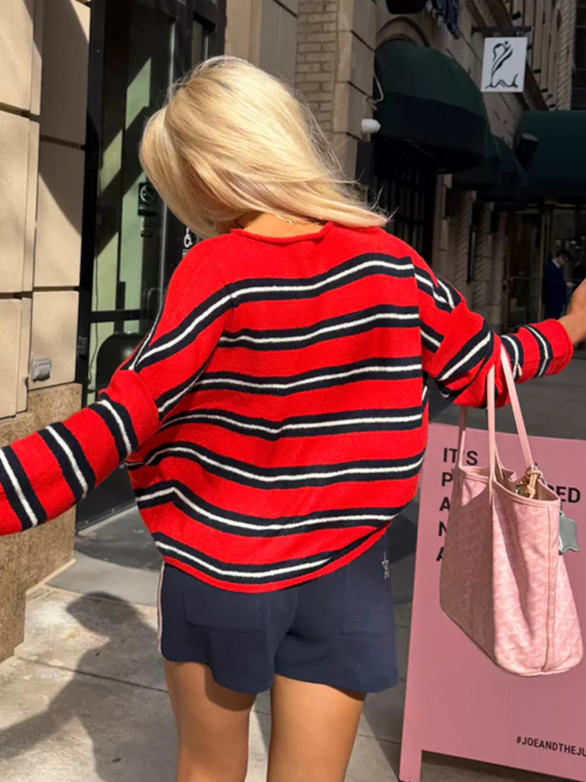 Red and black striped button-front cardigan, back view