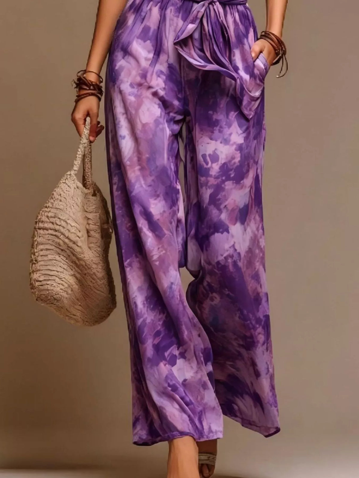 Purple tie-dye halter wide-leg jumpsuit, wide-leg pants detail.