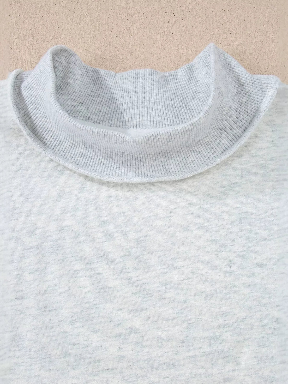 Mock-neck exposed-seam long sleeve sweatshirt