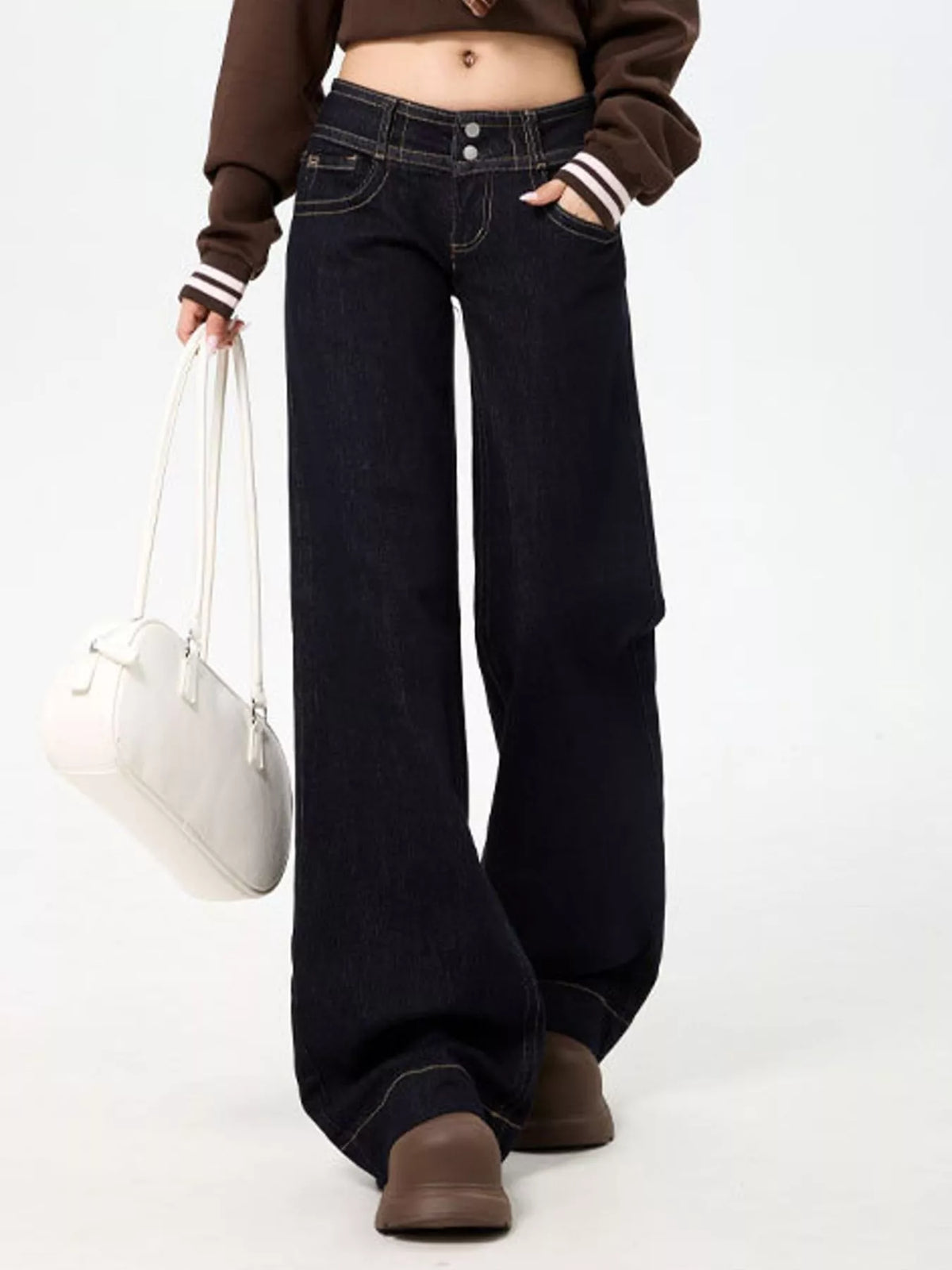 Black low-rise wide-leg jeans — front view