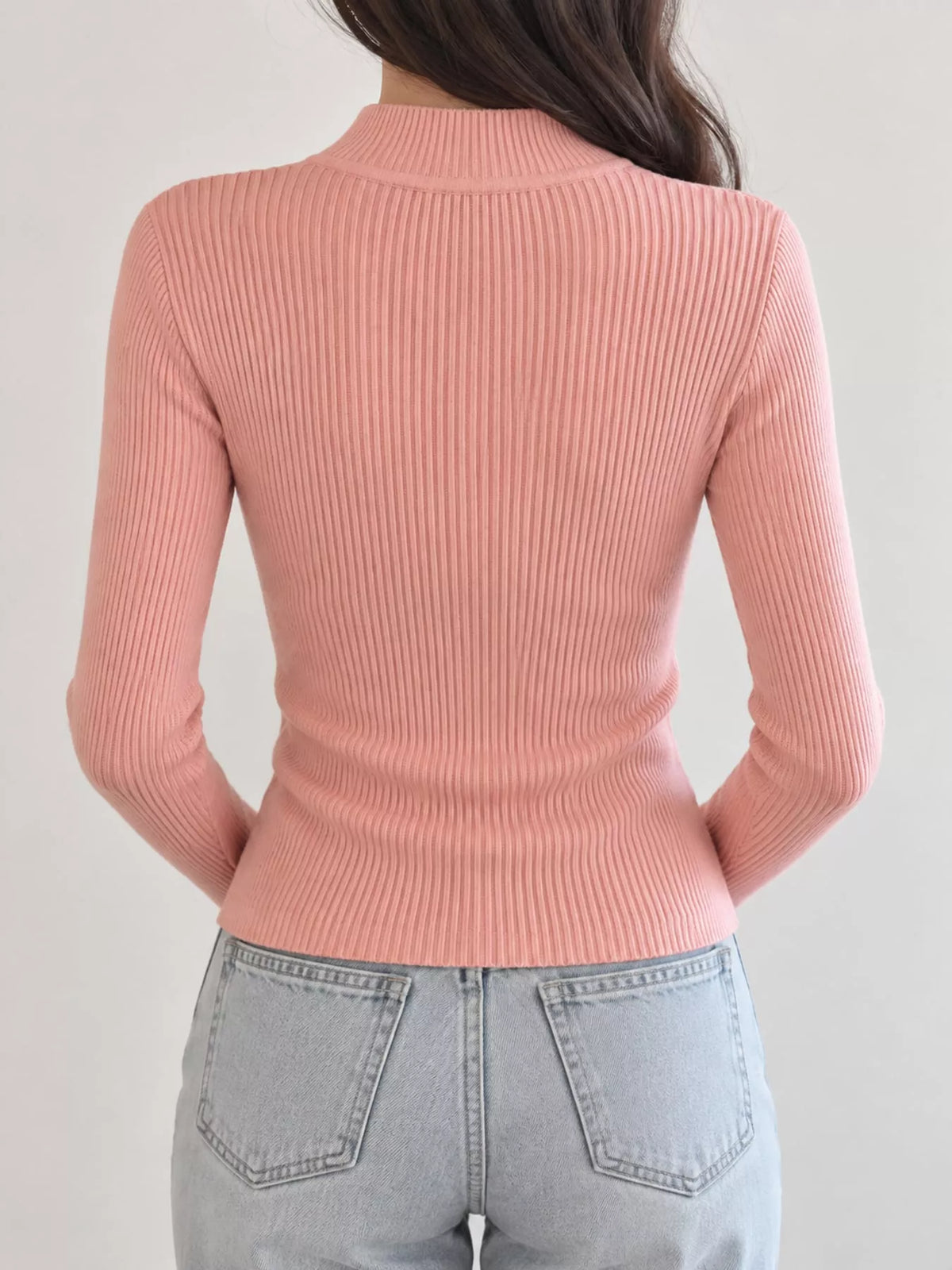 Peach ribbed mock neck long sleeve knit top, back view