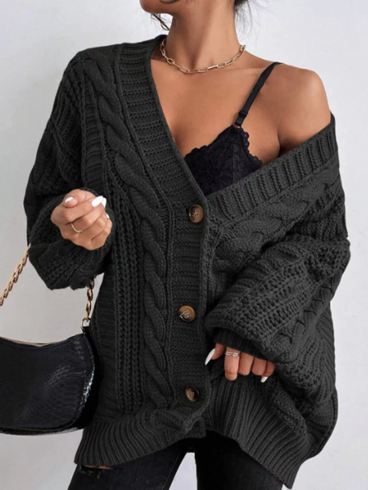 Black cable knit button-down cardigan