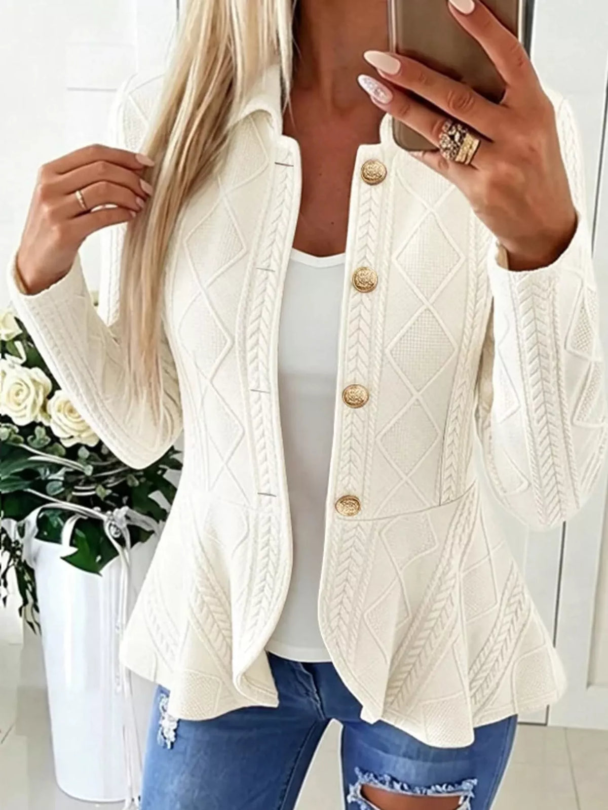 White cable-knit button-up cardigan — front view
