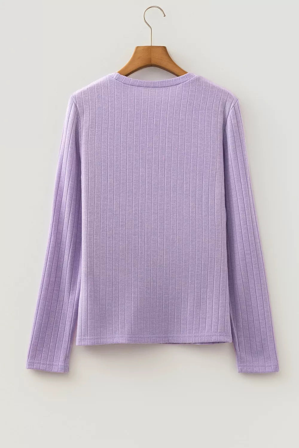 Purple ribbed long sleeve top, back on hanger