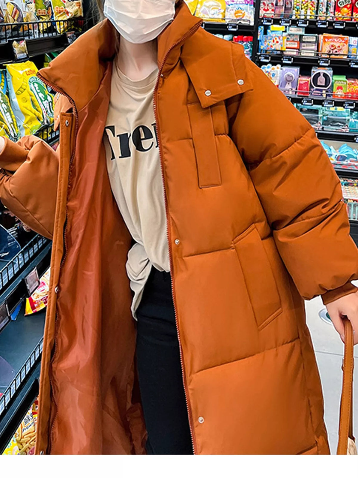 Longline puffer coat, orange collar front