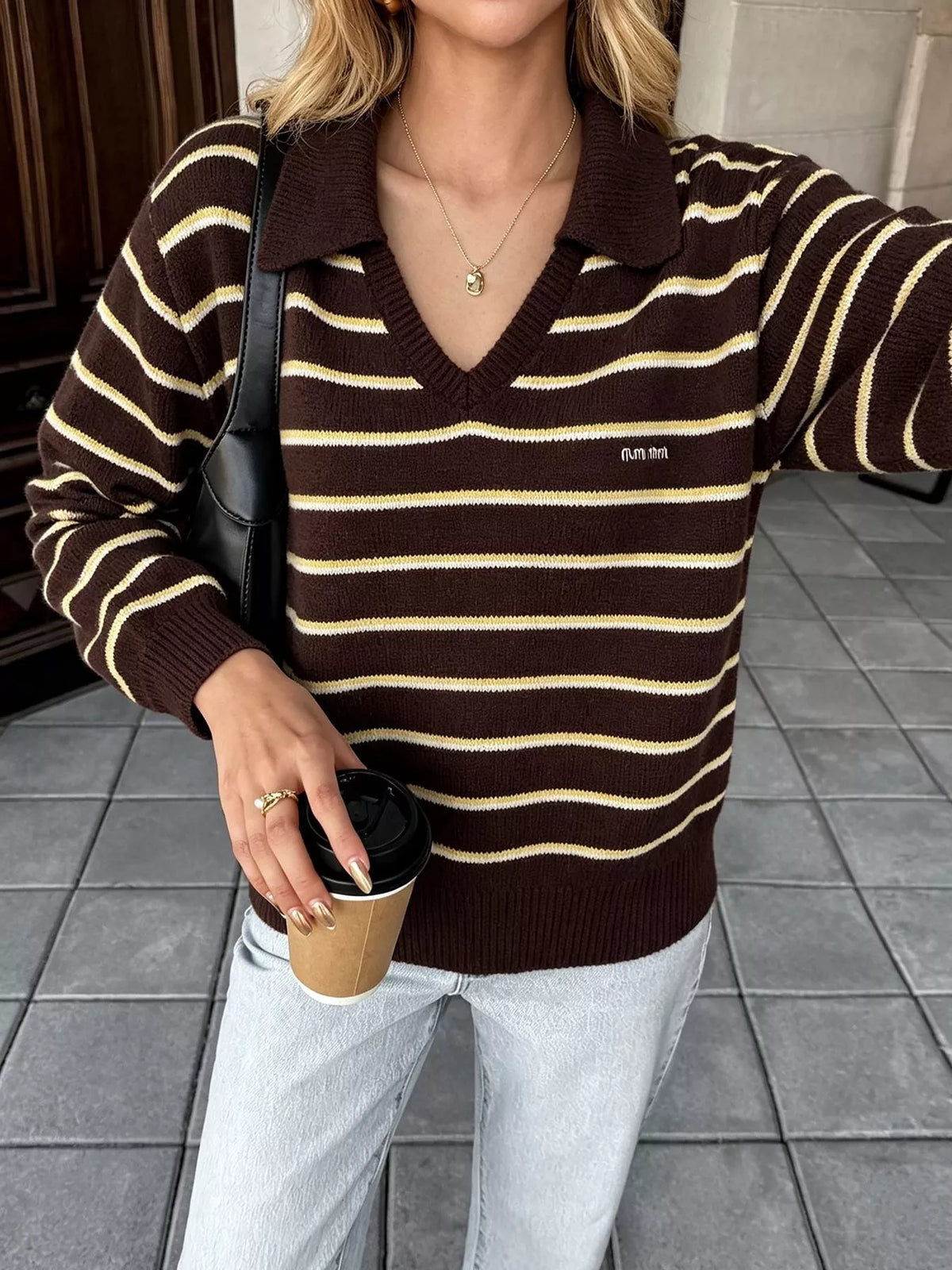 Brown and cream striped polo-collar sweater, front view showing ribbed hem.