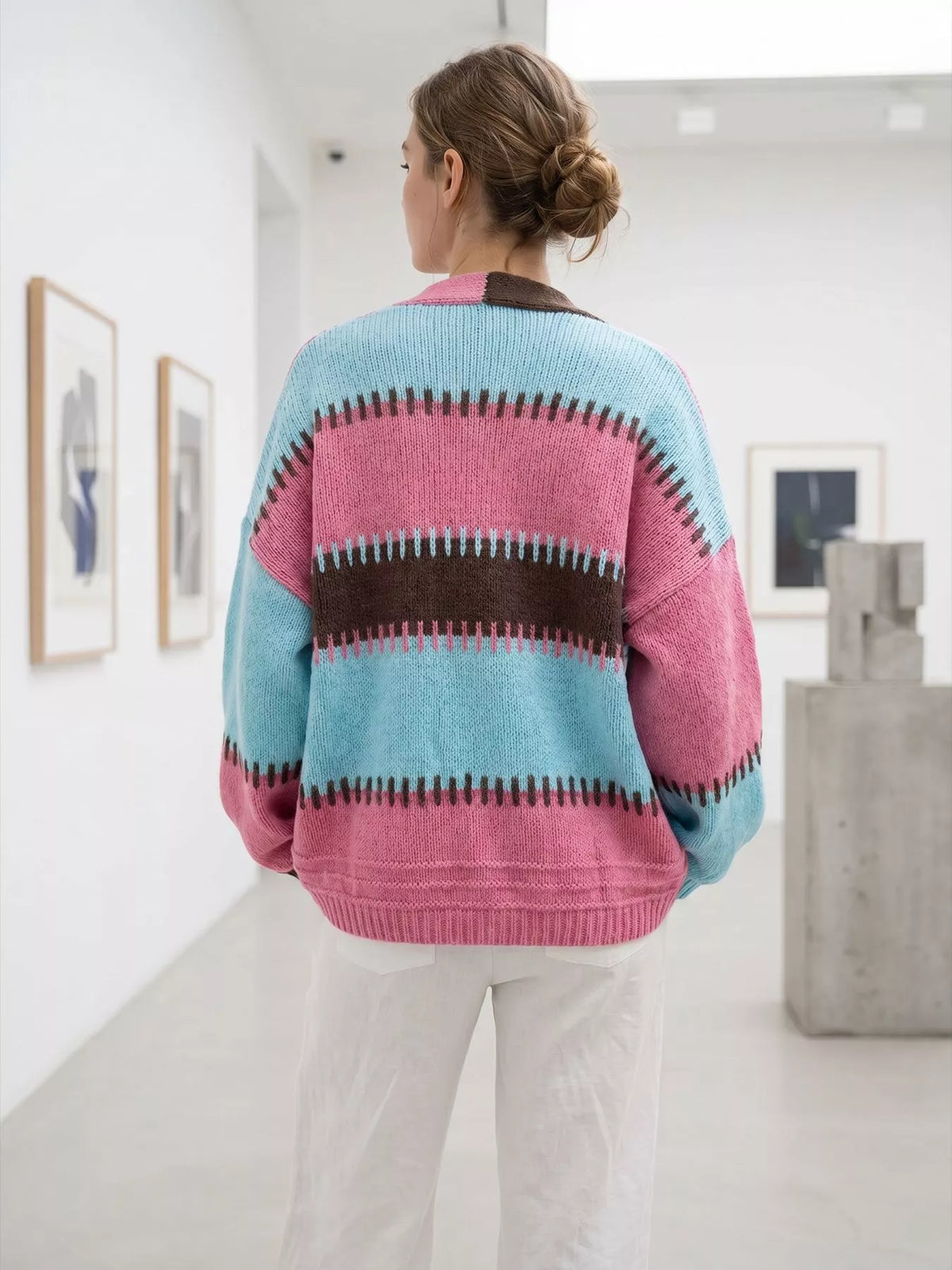 Pink and blue color-block v-neck cardigan, back view.