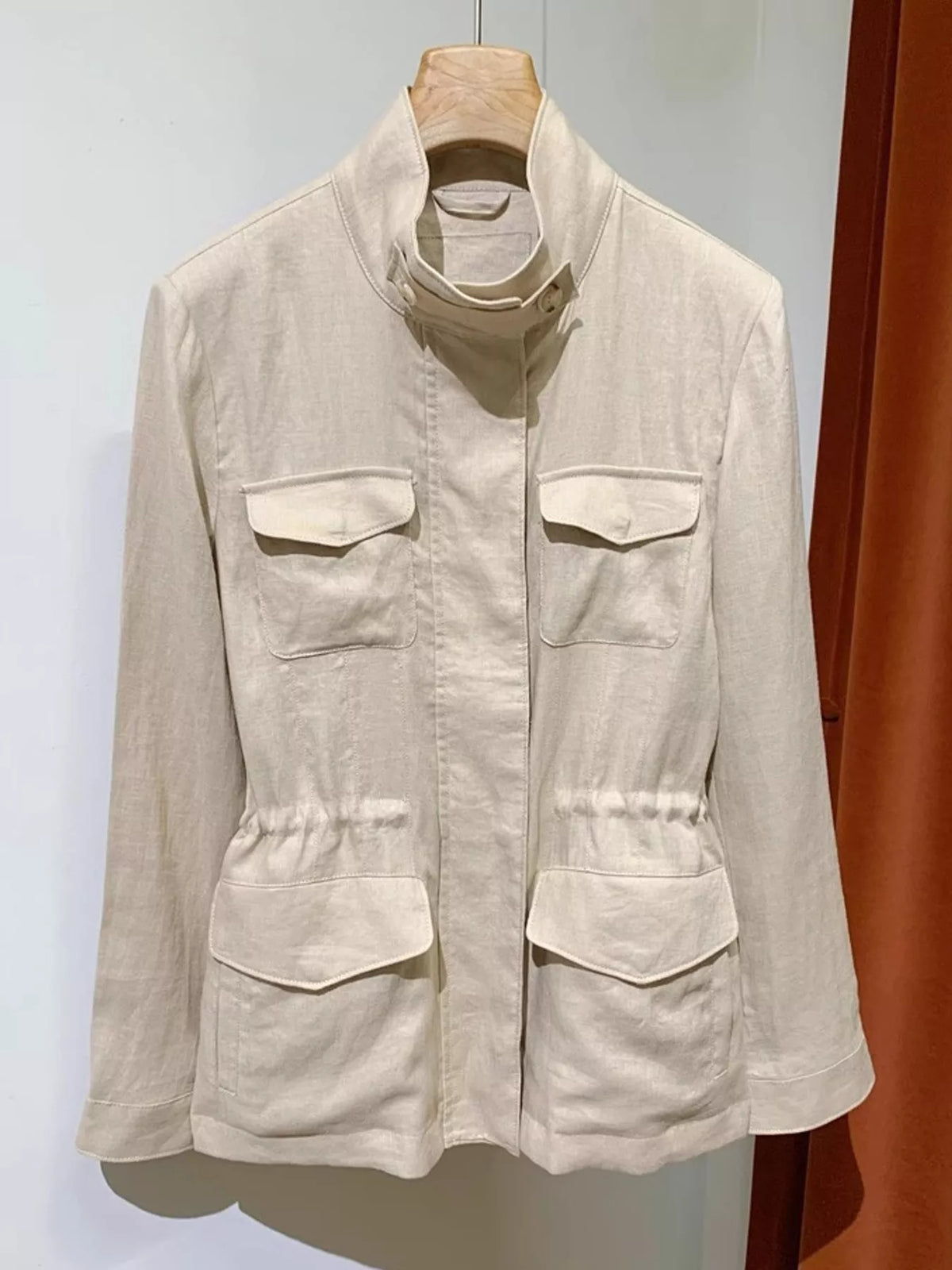 Beige lightweight multi pockets jacket — front view