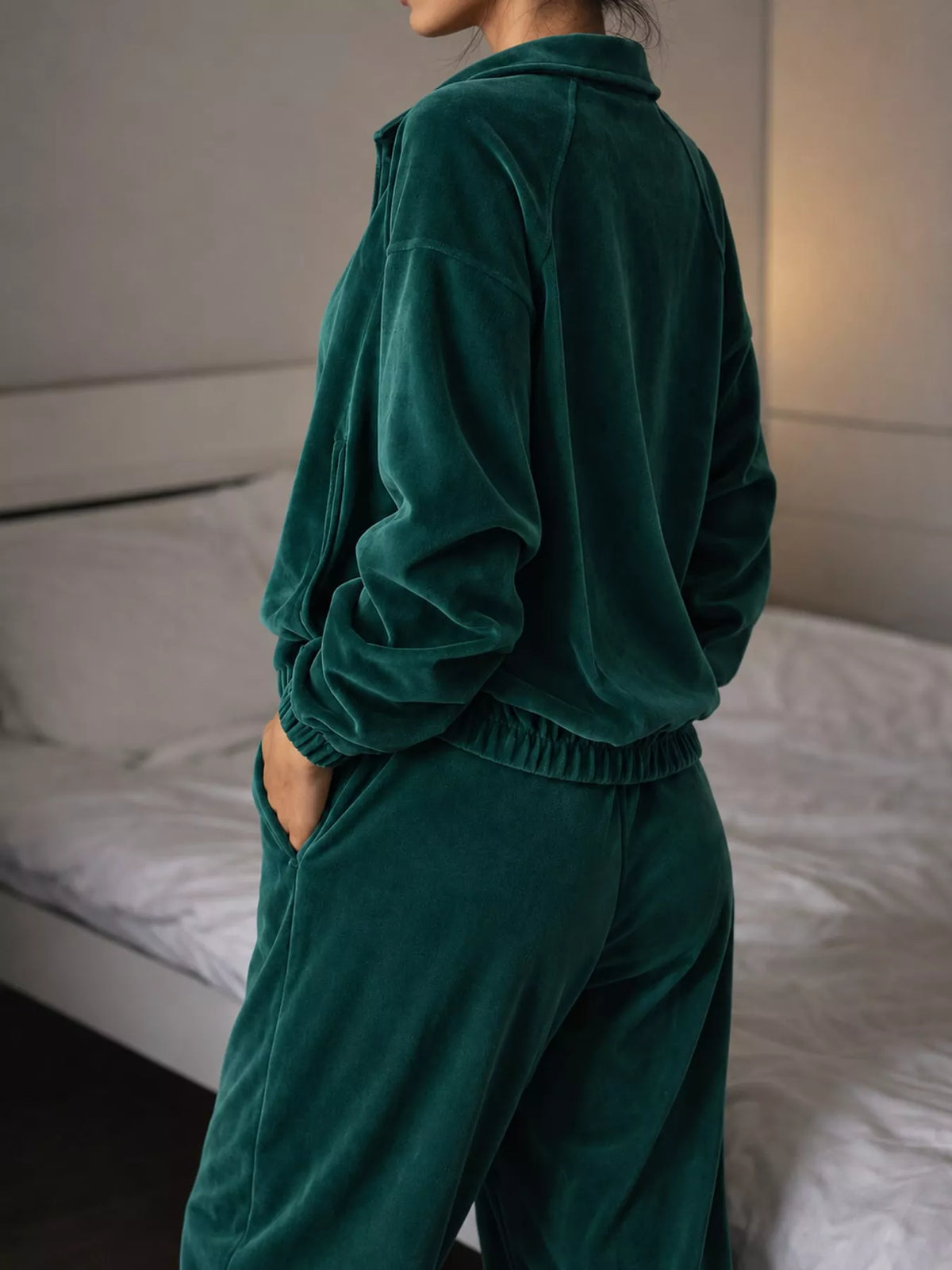 Green zip-up outerwear and pants set — back view