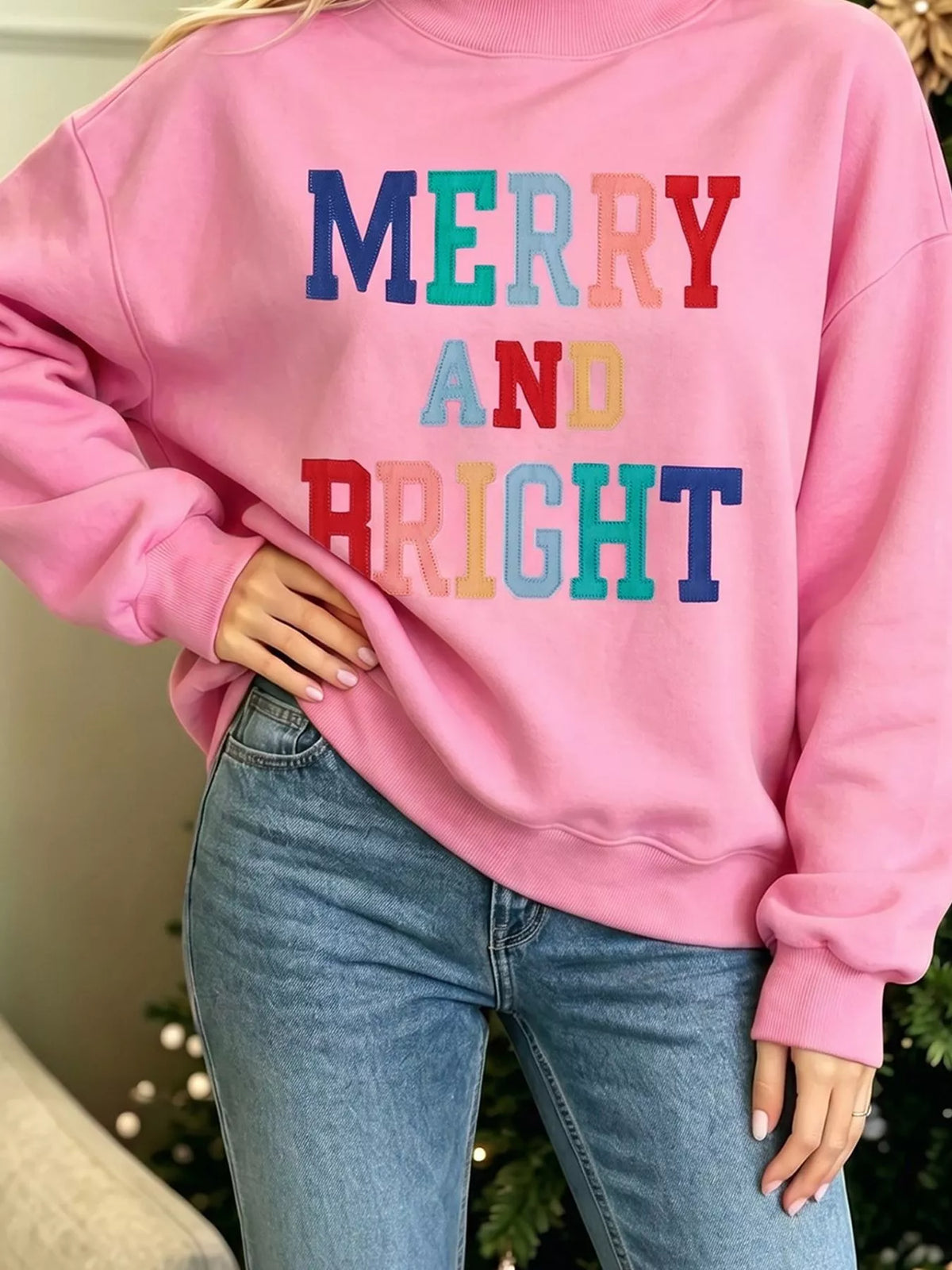 MERRY AND BRIGHT sweatshirt, pink slogan close up