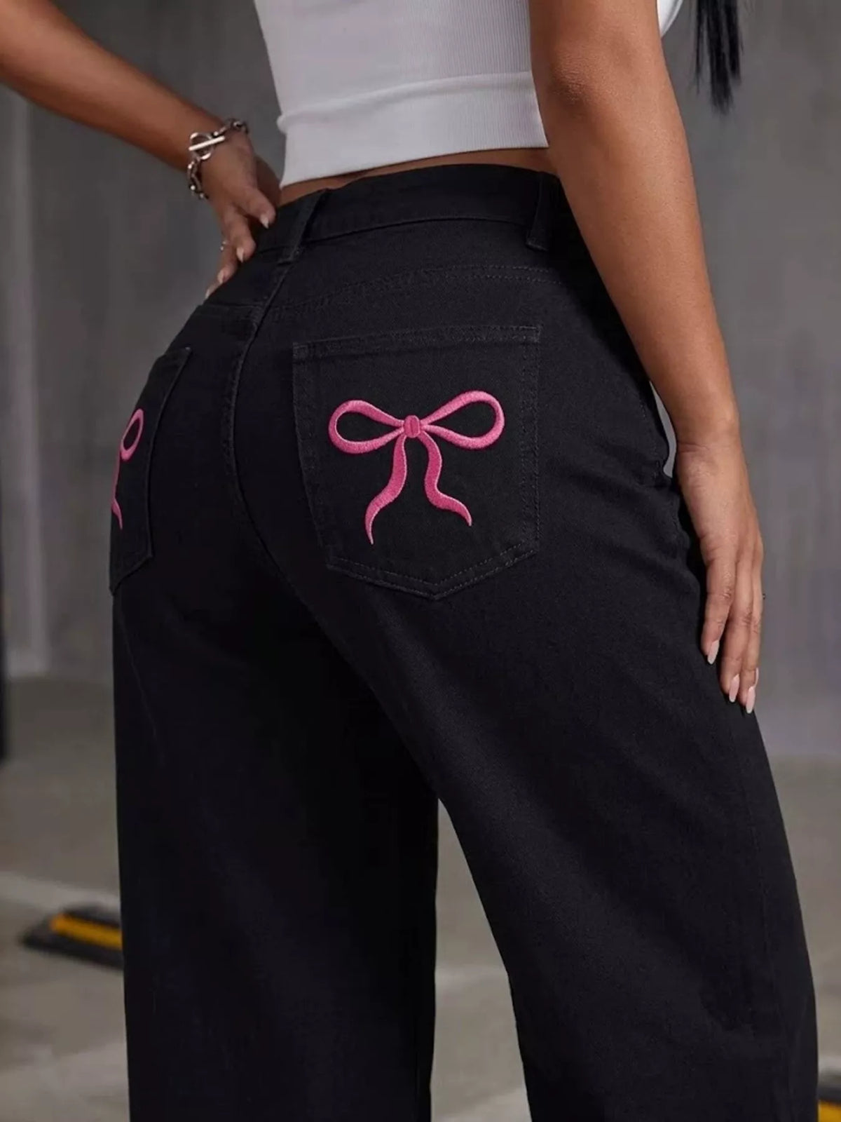 High-Waisted Bow Detail Wide-Leg Jeans in black, back pocket detail