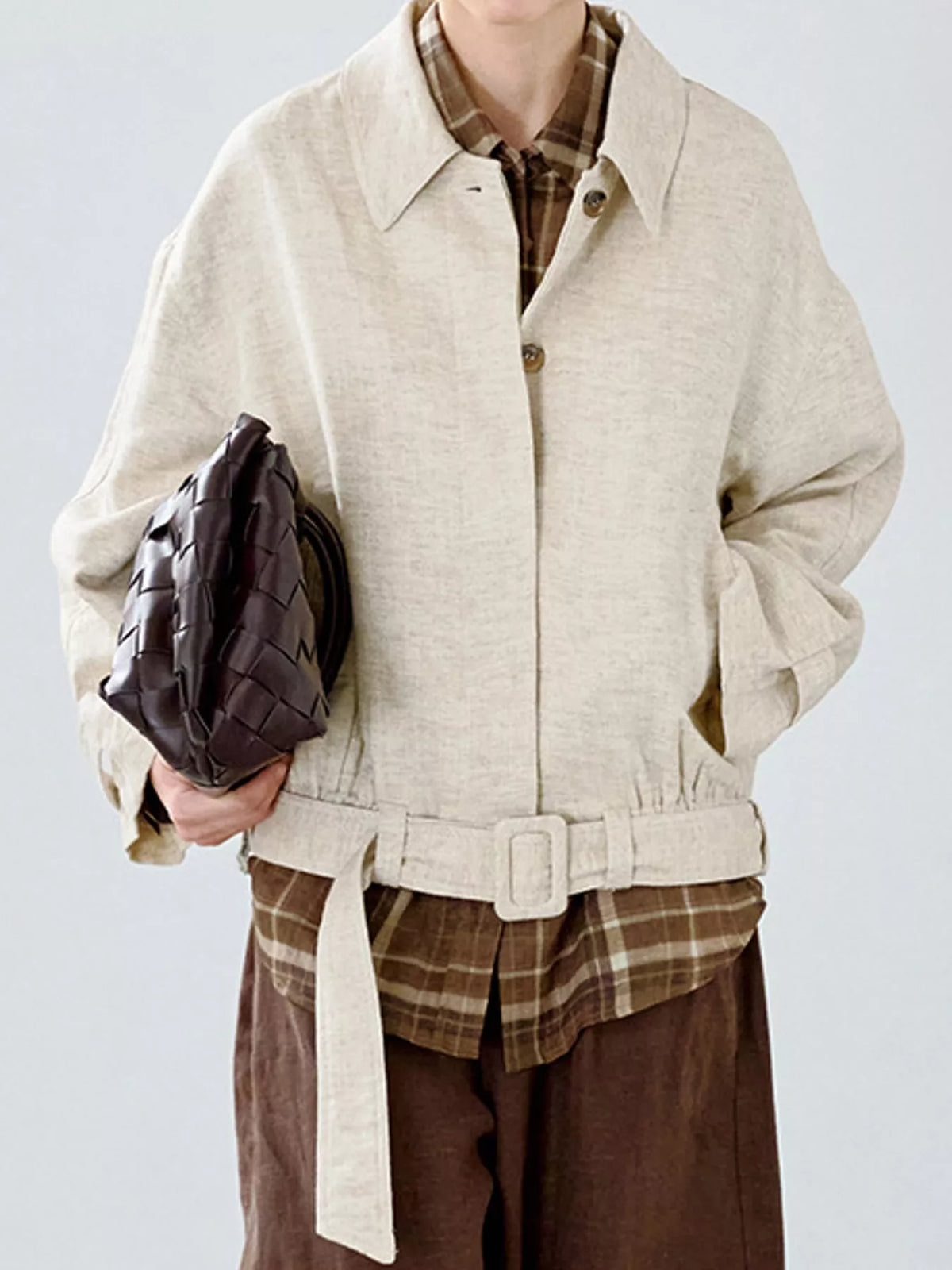Cream belted dropped shoulder jacket — front view