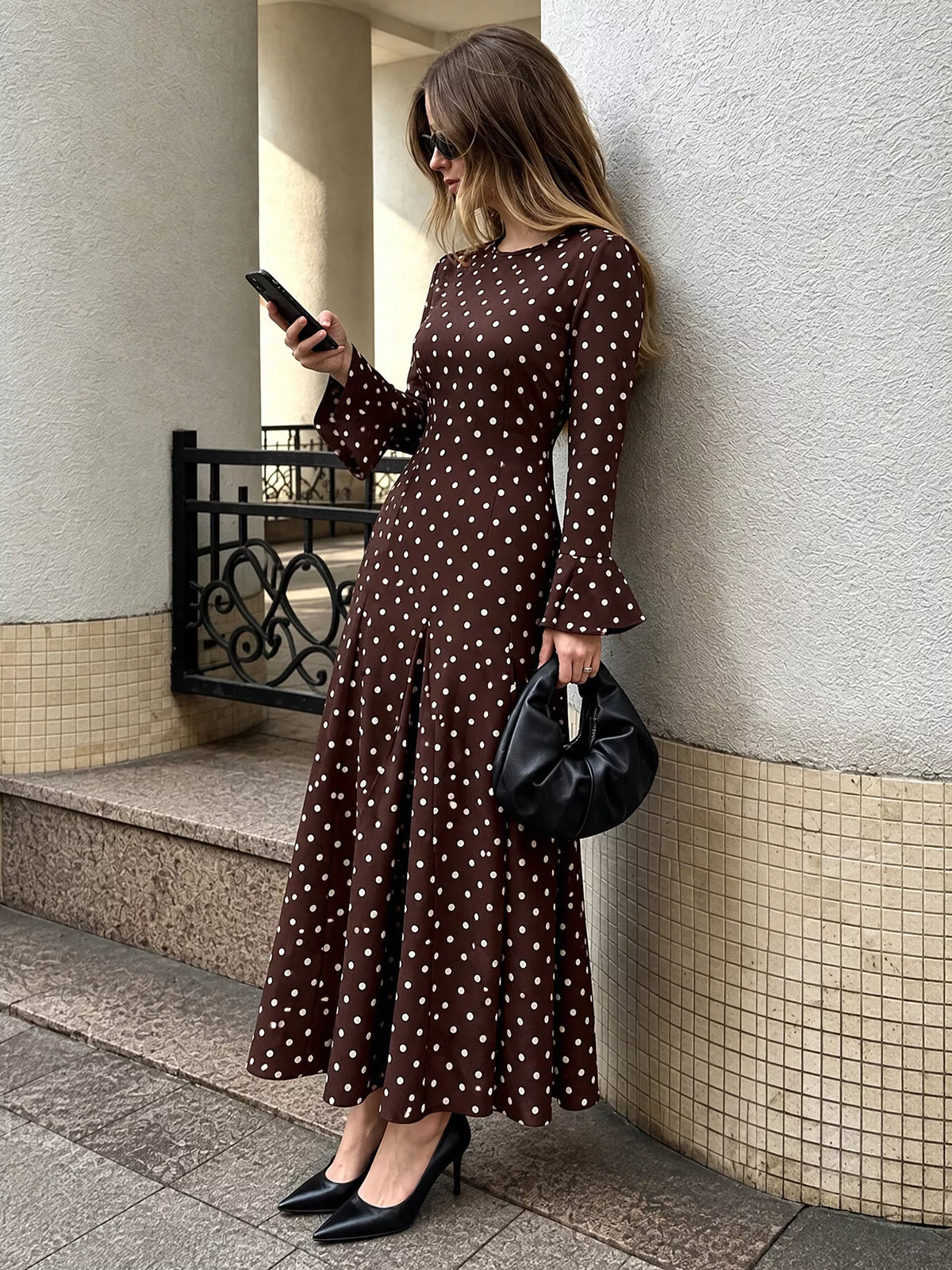 Brown polka dot long sleeve maxi dress, side view