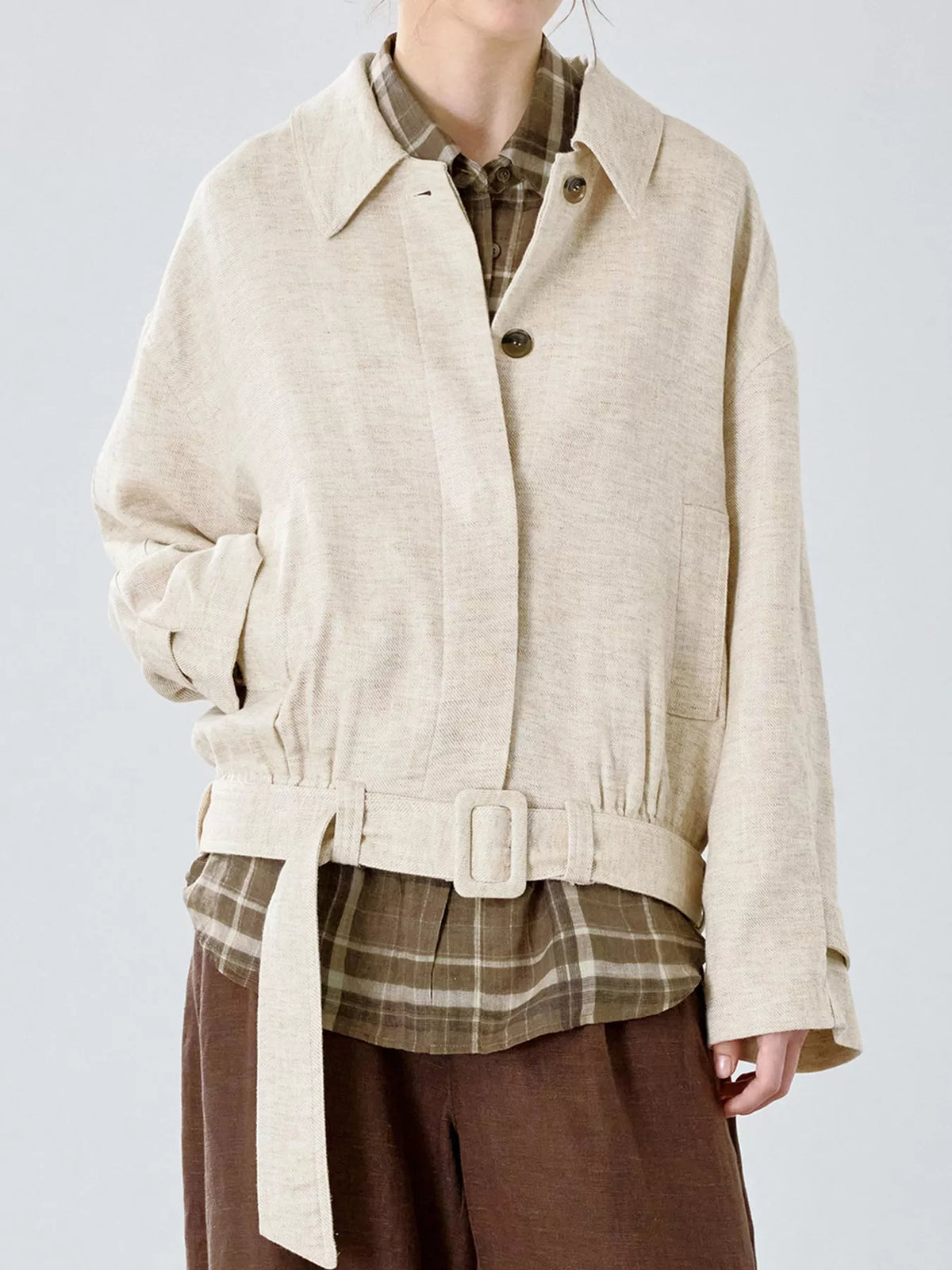 Cream belted dropped shoulder jacket — front view