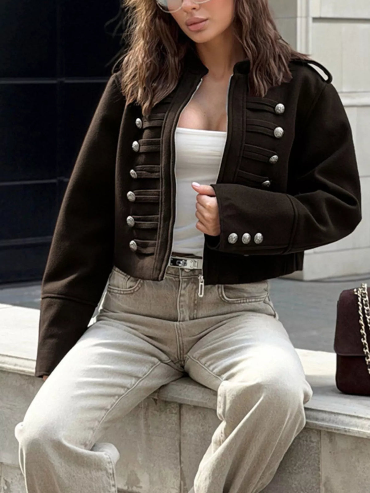 Black cropped zip-front jacket, seated front view