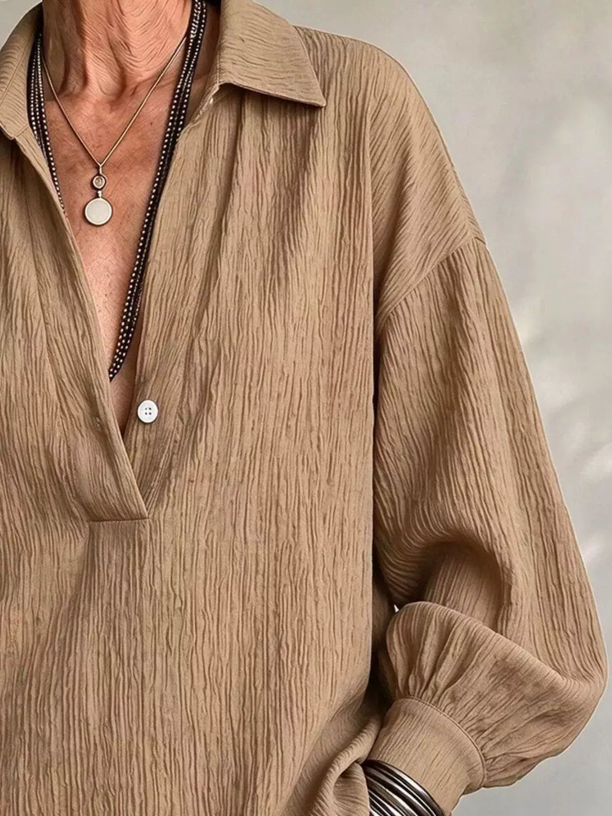 Women's Textured Lantern Sleeves Blouse in camel — neckline detail view