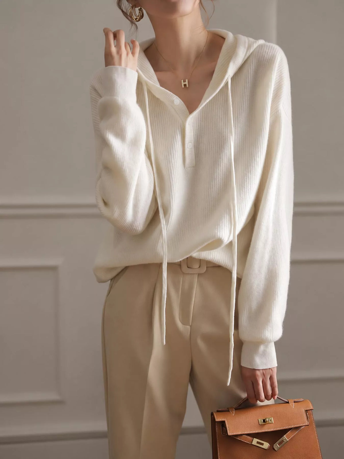 Hooded long sleeve sweater, front view on model