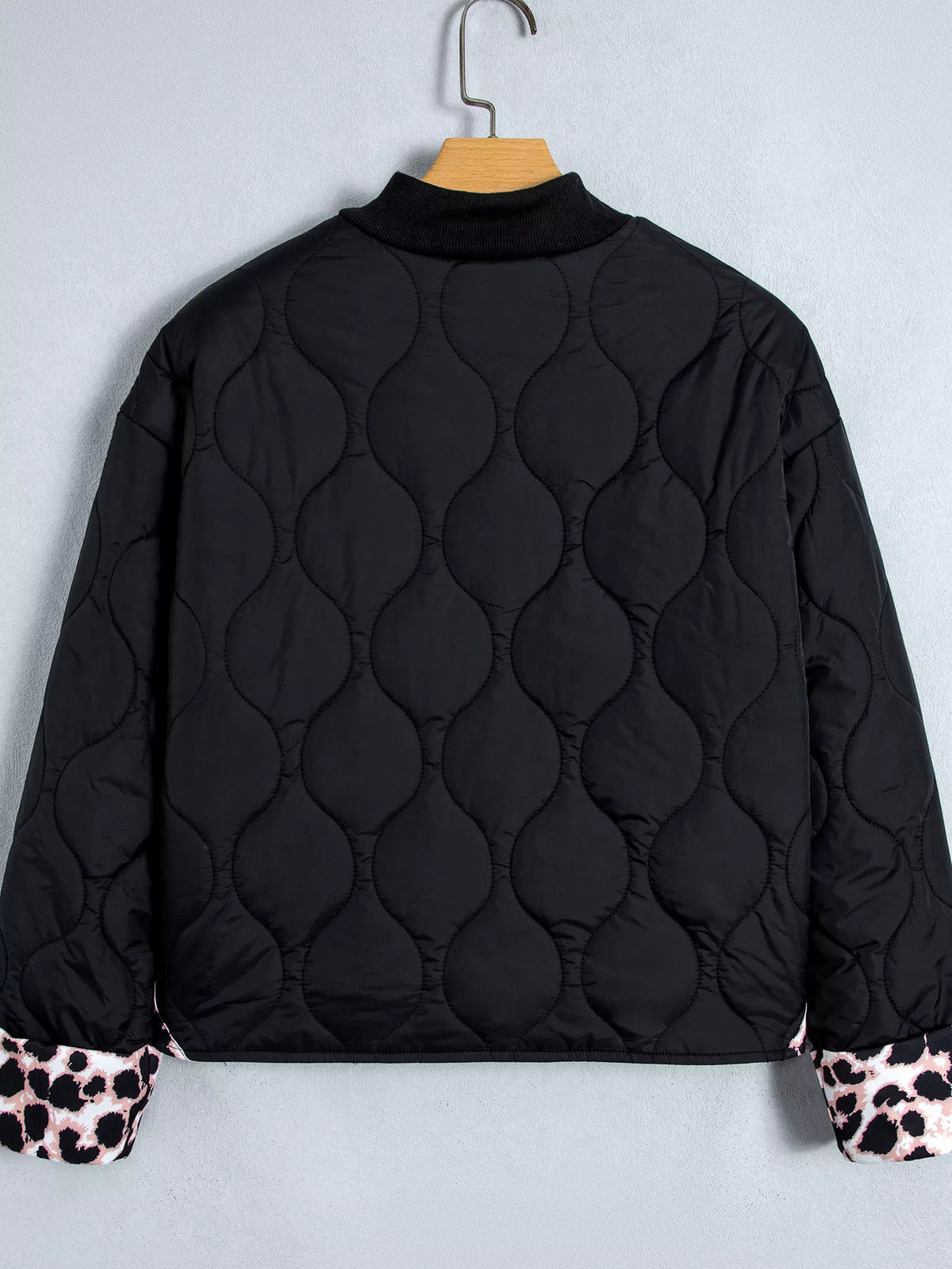 Quilted Leopard Cuff Button Down Puffer Jacket in black, back view