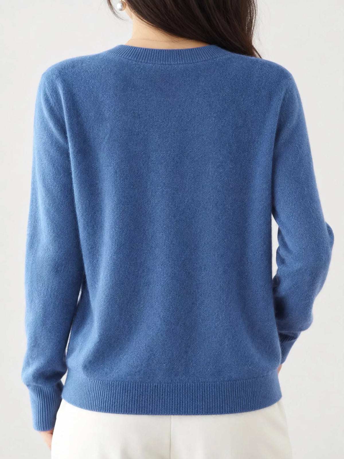 Blue crew neck button-front cardigan, back view