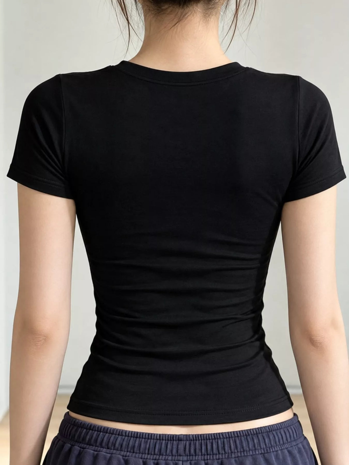 Black slim-fit crew neck T-shirt, back view