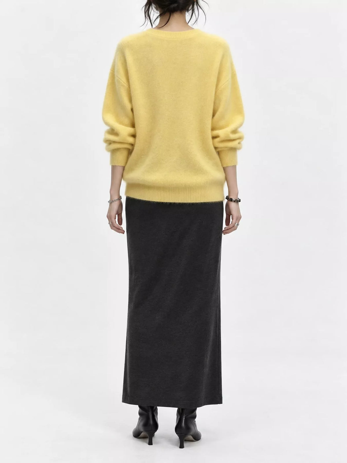 Yellow v-neck sweater, back view