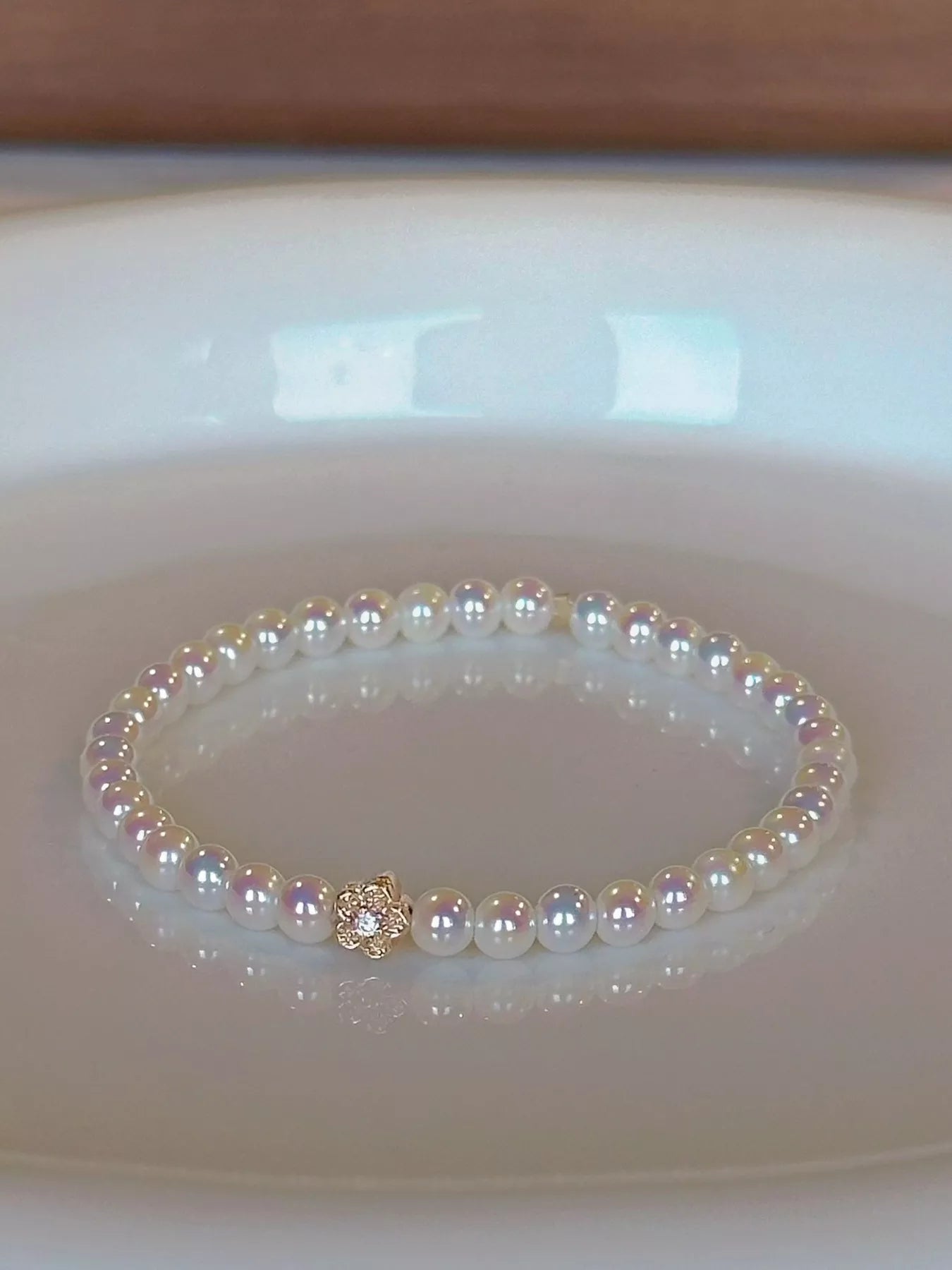 Trendsi Pearl Bracelet with Floral Accent -